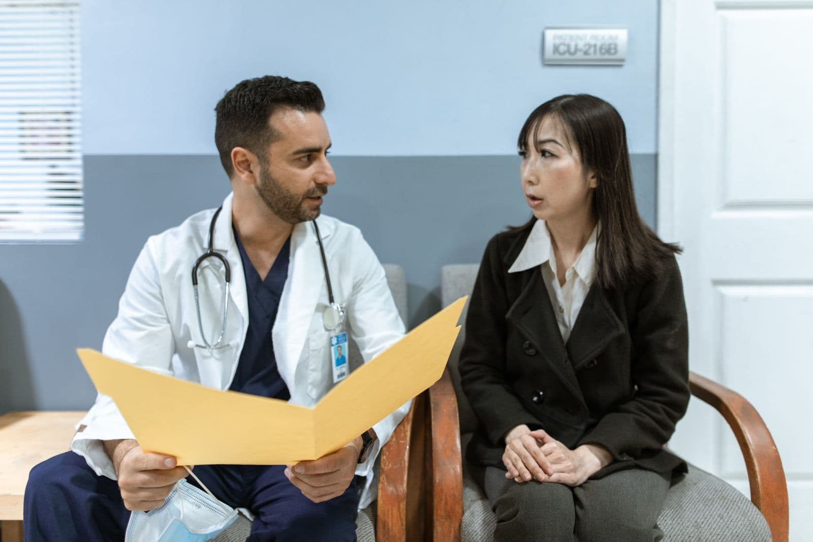 A physician consulting with a patient in a clinical setting