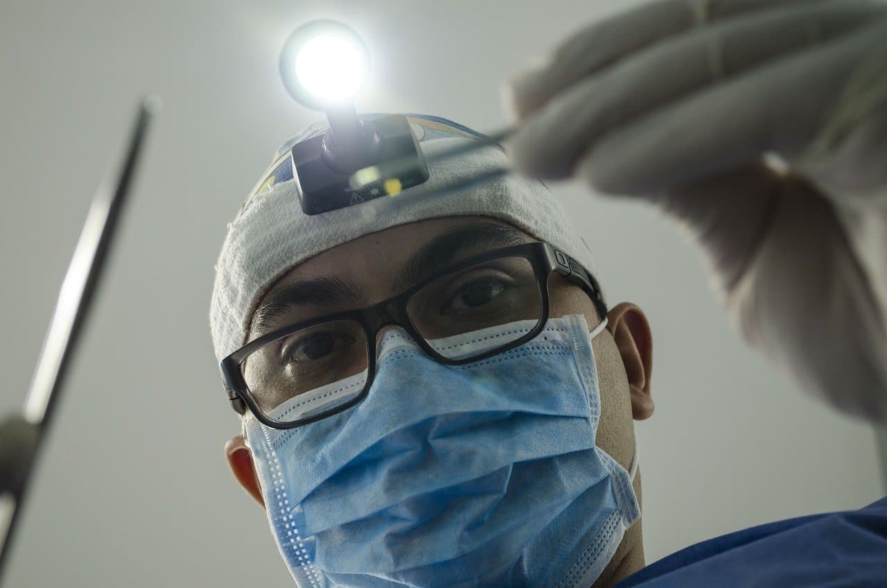 Dentist examining a patient's teeth during a routine check-up