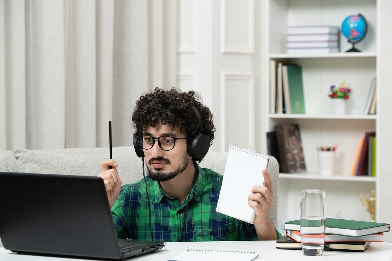 Adult student reviewing coursework at a laptop